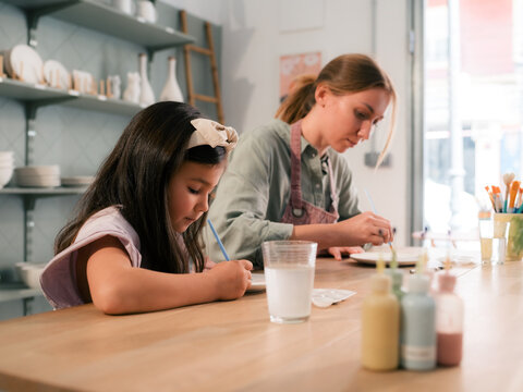 Mother and daughter spending time together at craft studio