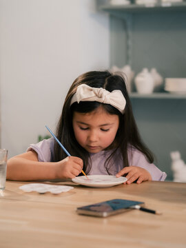Girl is at painting classes in studio
