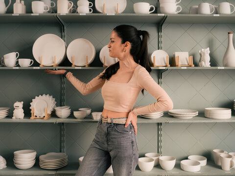 Proud store owner showing her goods