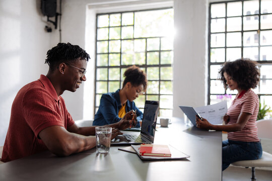 Team Collaborating in Modern Coworking Office