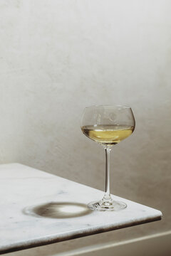 Glass of Drink on a Table in a Softly Lit Space