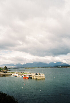 Fishing Boats in Scenic Mountain Harbour