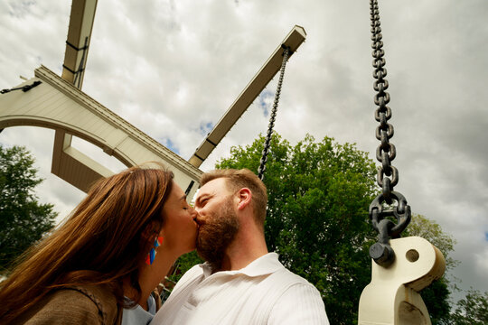 Couple Sharing a Kiss on an Amsterdam bridge