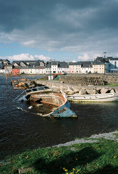 Abandoned Wooden Boats in Coastal Harbour