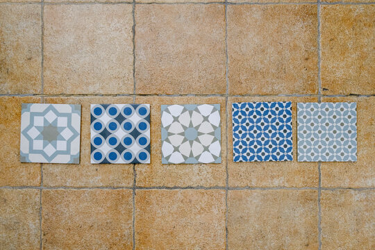 Patterned tile samples arranged on showroom floor