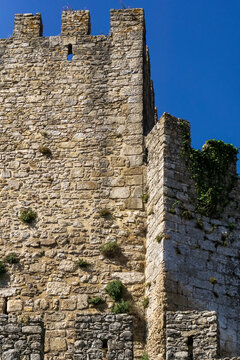 Ancient Portuguese stone fortification beneath blue sky