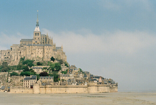 Hazy day view of Mont Saint Michel at low tide