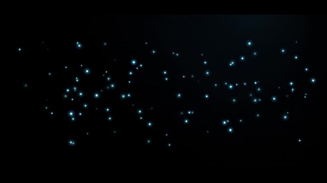 Abstract blue particles float gently in dark atmosphere with subtle light glow and bokeh effect