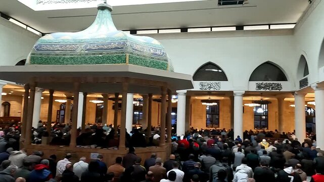 Grand Husseini Mosque in Amman Downtown - Jordan : A group of Muslims performing congregational prayer in the mosque (a communal act of worship)