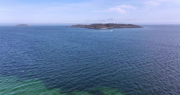 Aerial View of Misery Island near Salem Massachusetts with Passing Motorboat
