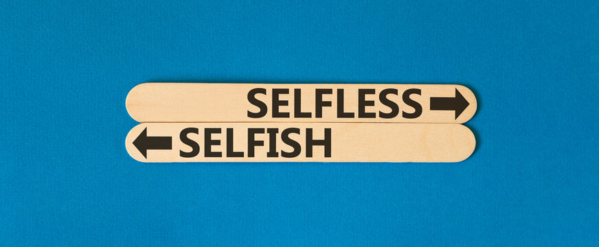 Selfless instead selfish words symbol. Concept words Selfless Selfish on beautiful wooden sticks. Beautiful blue background. Business medical psychology selfless selfish concept. Copy space.