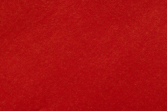 Vibrant Red Paper Texture Macro Background,A macro close-up photograph of a vibrant red paper texture. This rich and bold paperboard surface displays subtle fiber details, making it ideal for Chinese 