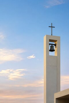 Minimal bell tower against blue sky