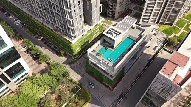 Residential apartment community with swimming pool and greenery aerial gated community real estate