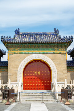 Traditional ancient Chinese red gate with blue tiled roof at the Temple of Heaven, Beijing, China