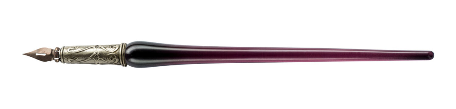 Vintage dip pen with a glass handle and metal pointed nib, isolated on a white background. Traditional writing instrument suitable for calligraphy, handwriting, lettering, drawing