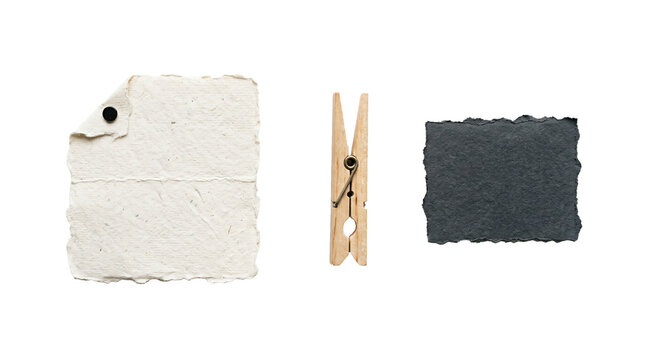 Textured handmade beige paper scraps alongside a rustic wooden clothespin displayed neatly on transparent background