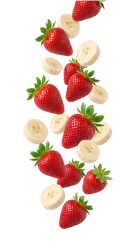 Vibrant fresh strawberries and sliced bananas levitating and falling in midair, dynamically isolated on a pure transparent background for a healthy food, smoothie ingredient, and diet concept.
