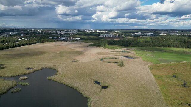 Aerial drone footage of Lammassaari Island in Helsinki, Finland, showing the peaceful natural landscape, surrounding sea, forests, and coastline. Scenic Nordic nature near the Finnish capital.