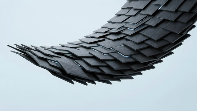 A curved, tail-like structure composed of dark gray, rectangular slate tiles overlapping in a rhythmic, layered pattern against a light-blue