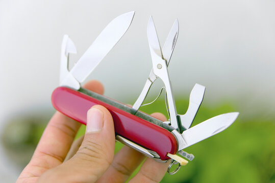 Swiss Army pocket knife multi tool with extended stainless steel blades and scissors with copyspace