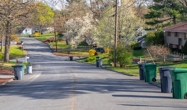  trash cans on the residential street in curbside collection day
