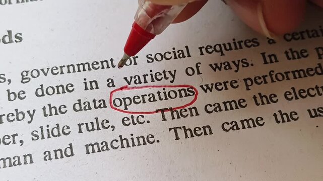 Hand with red pen mark circle to emphasize or highlight Operations word on business document page. Person focus on operation failure, efficiency, concern, control, strategy or coordination problems.