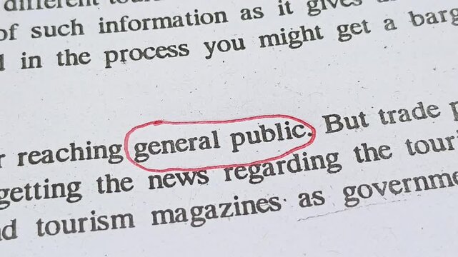 Closeup of hand with red ink pen mark circle around to emphasize or highlight General Public word on news paper article page. Ordinary or common working class people problems concept.