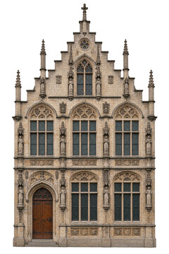 Ornate gothic facade of a historic stone building with detailed statues and arched windows