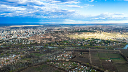 Fototapeta premium Neuquén's skyline meeting the wide Patagonian horizon under a bright sky, Argentina.