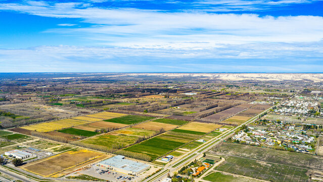 Aerial view of a patchwork of fruit plantations and farmland in a Patagonian valley, Argentina.
