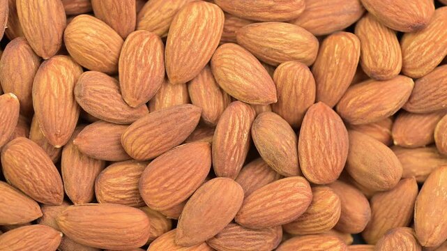 Almonds close-up, top view, rotating 
