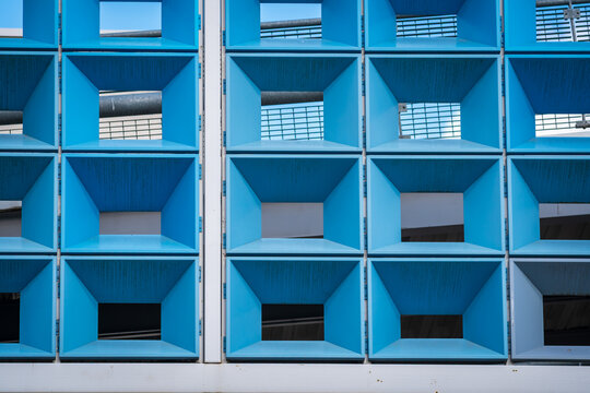 Modern Architectural Grid With Geometric Square Openings and Blue Sky Views