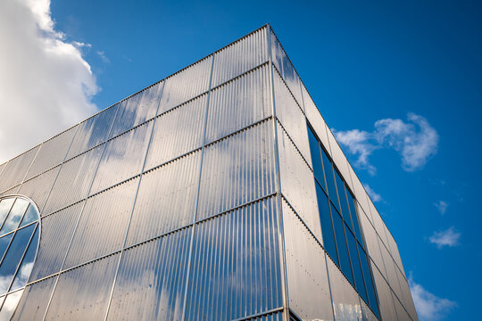 Modern Glass Office Building With Blue Reflection And Abstract Facade In Urban Architecture in England UK