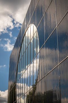 Modern Glass Office Building With Blue Reflection And Abstract Facade In Urban Architecture in England UK