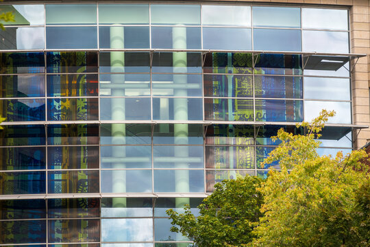 Modern Glass Office Building With Blue Reflection And Abstract Facade In Urban Architecture in England UK