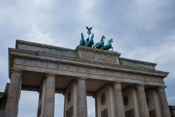 Brandenburg Gate or Brandenburger Tor monument biggest landmark in Berlin, Germany close up low angle view with grey moody sky background © elifilm