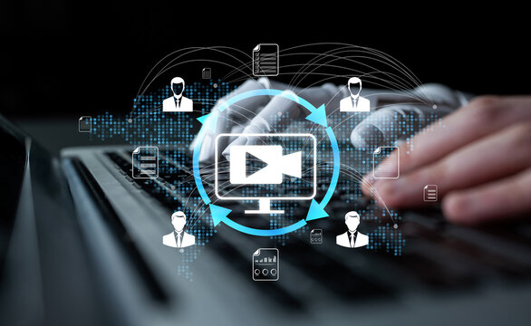 A person types on a laptop with multimedia icons surrounding them, symbolizing digital communication and networking in a contemporary work environment. Nascent