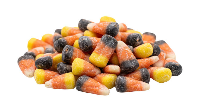 A pile of traditional tri-colored candy corn isolated on a clean white background for autumn