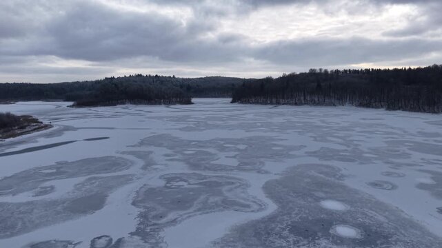 Winter landscape of the frozen lake in Poland.