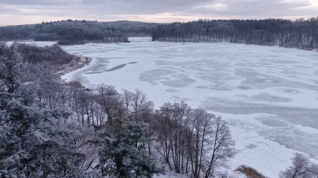Winter landscape of the frozen lake in Poland.