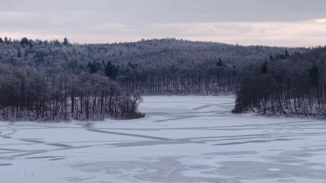 Winter landscape of the frozen lake in Poland.