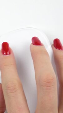 Woman Hand with red nails using white mouse