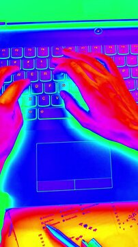 Female using laptop computer on office table changing colors effect