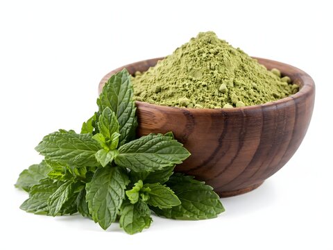 Fresh matcha green tea powder in wooden bowl with mint leaves on white background