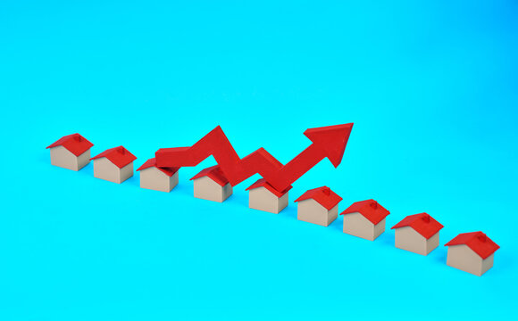 Miniature houses beneath an upward zigzag arrow represent housing market expansion and rising real estate demand.
