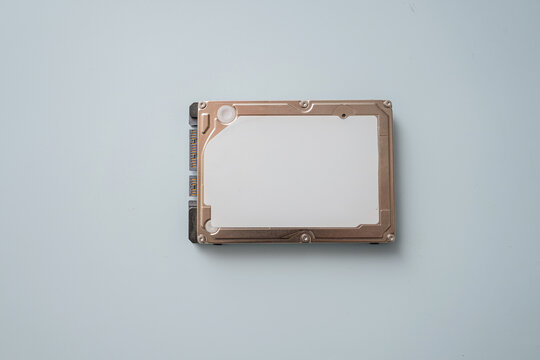 Hard drive placed on a plain background with no other items or distractions