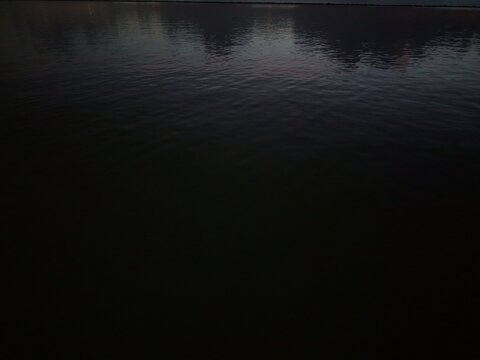 Night sky reflecting in ocean