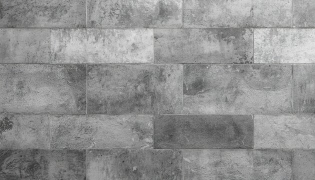 Industrial gray concrete tile texture with weathered cement blocks and a rugged stone-like surface, seamless architectural background for interior design and modern decor.