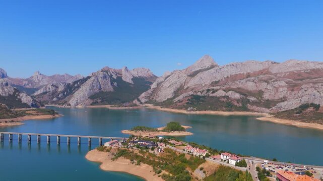 Summer rural tourism in the village of Ria&ntilde;o in Le&oacute;n, Spain. Aerial view of riano village reservoir and mountains in spain